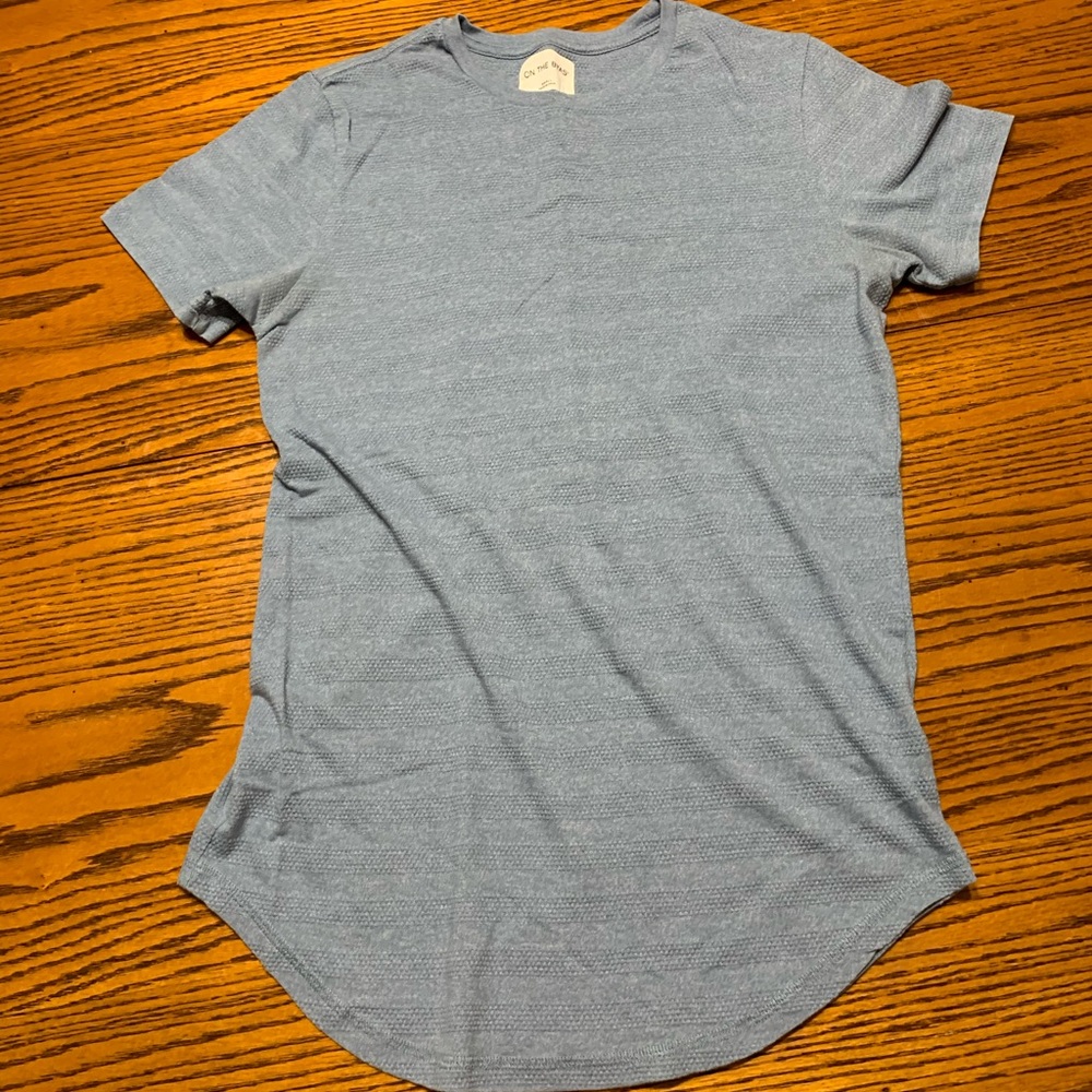 on the byas pac sun small blue tee shirt